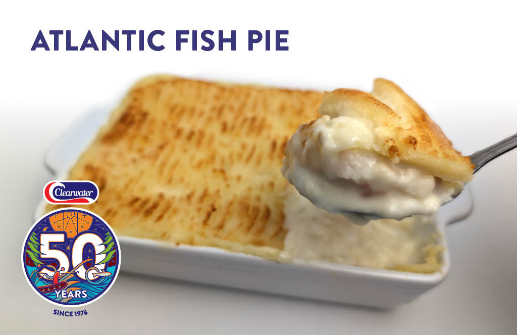 Atlantic recipe Fish pie with scallops, haddock, salmon and shrimp, topped with mashed potatoes and baked in oven
