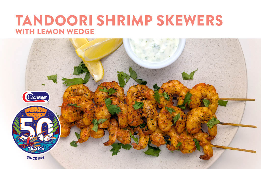 Indian Tandoori spiced shrimp on skewers with lemon